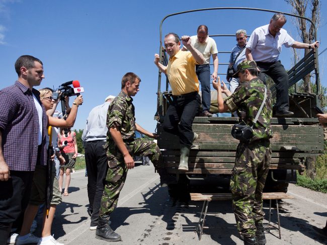 Romanian prime-minister Emil Boc (yellow shirt) is visiting Șendreni village which is under a flood warning on July 3rd, 2010.