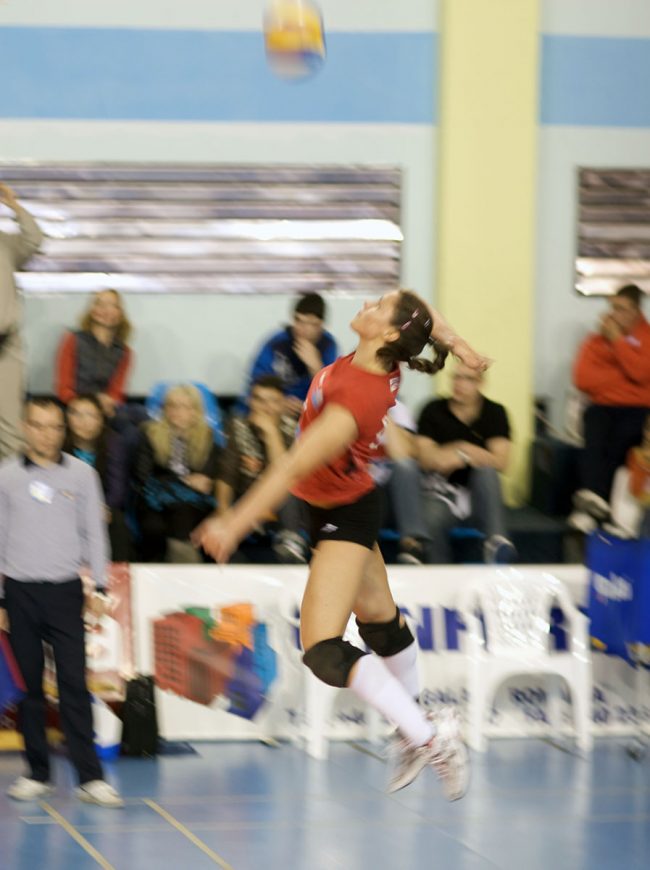 Voleyball player is serving in a game played in Galați, Romania on April 24th, 2010.