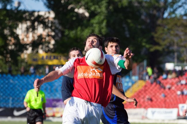 Football players are fighting for the ball in a game played in Galați, Romania on May 6th, 2008.