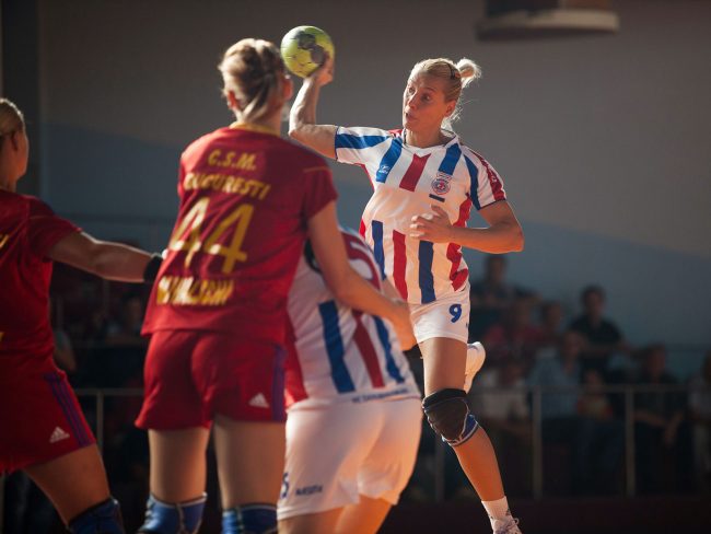 Handball players are fighting for the ball in a game played in Galati, Romania on September 6th, 2012.